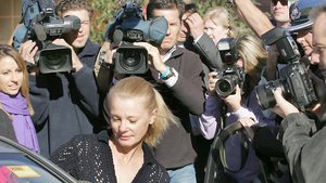 Lucy Dudko dogged by the media as she is released from prison in 2006 (photo: Herald Sun, 1 June 2013)